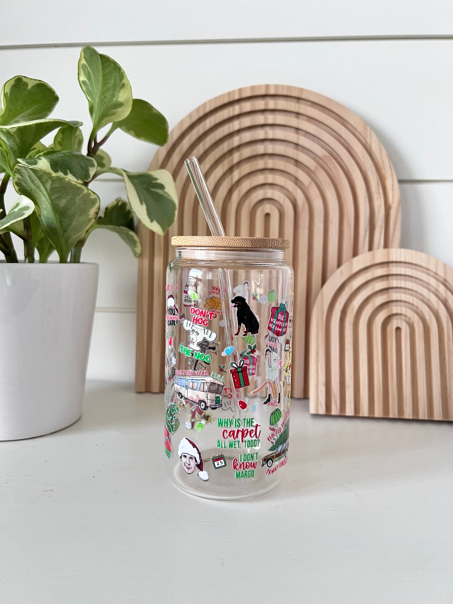 Glass cup with bamboo lid and glass straw featuring all the iconic Christmas vacation movie clips