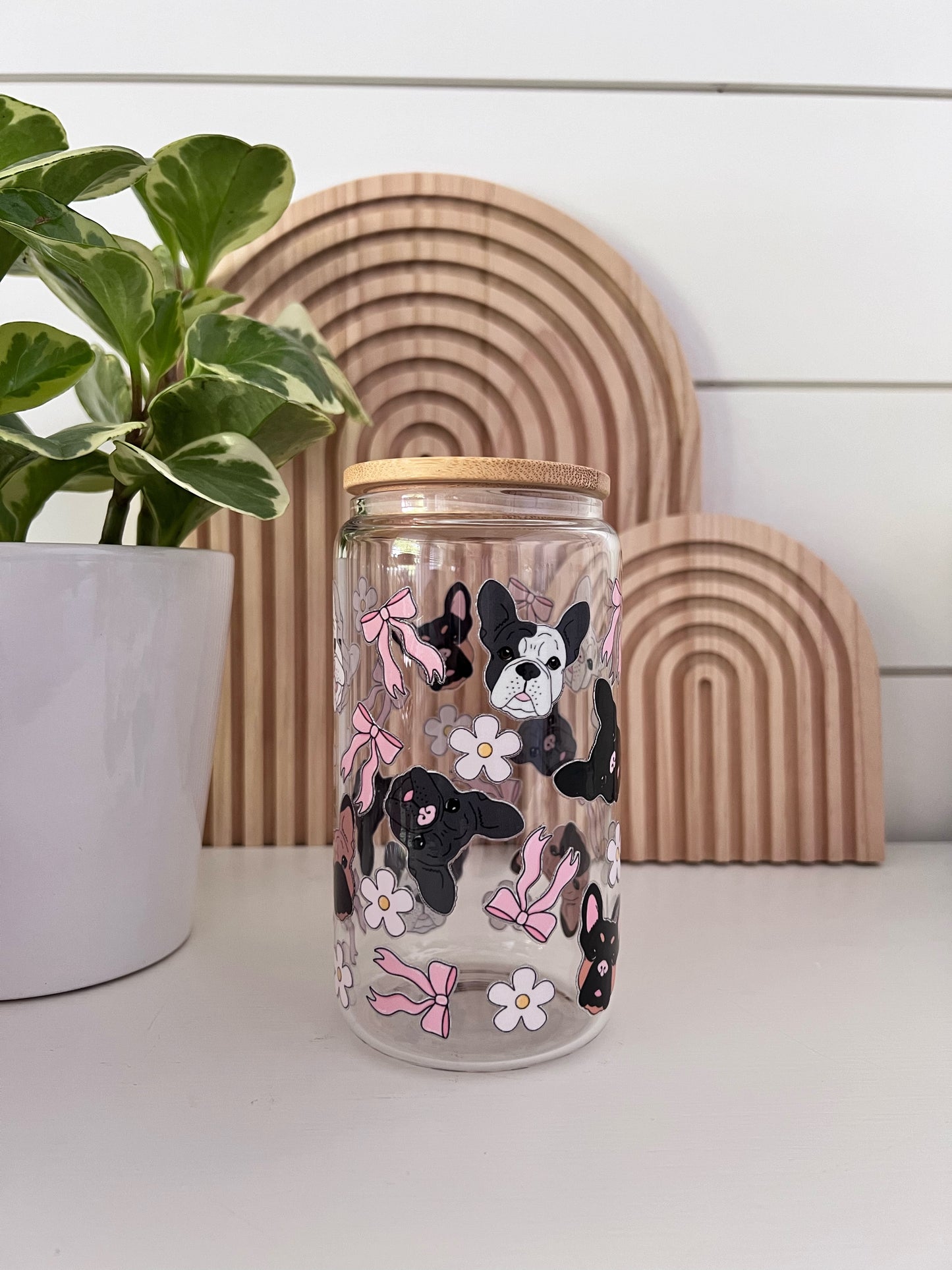 Glass Cup with different colored frenchies along side bows and daisys