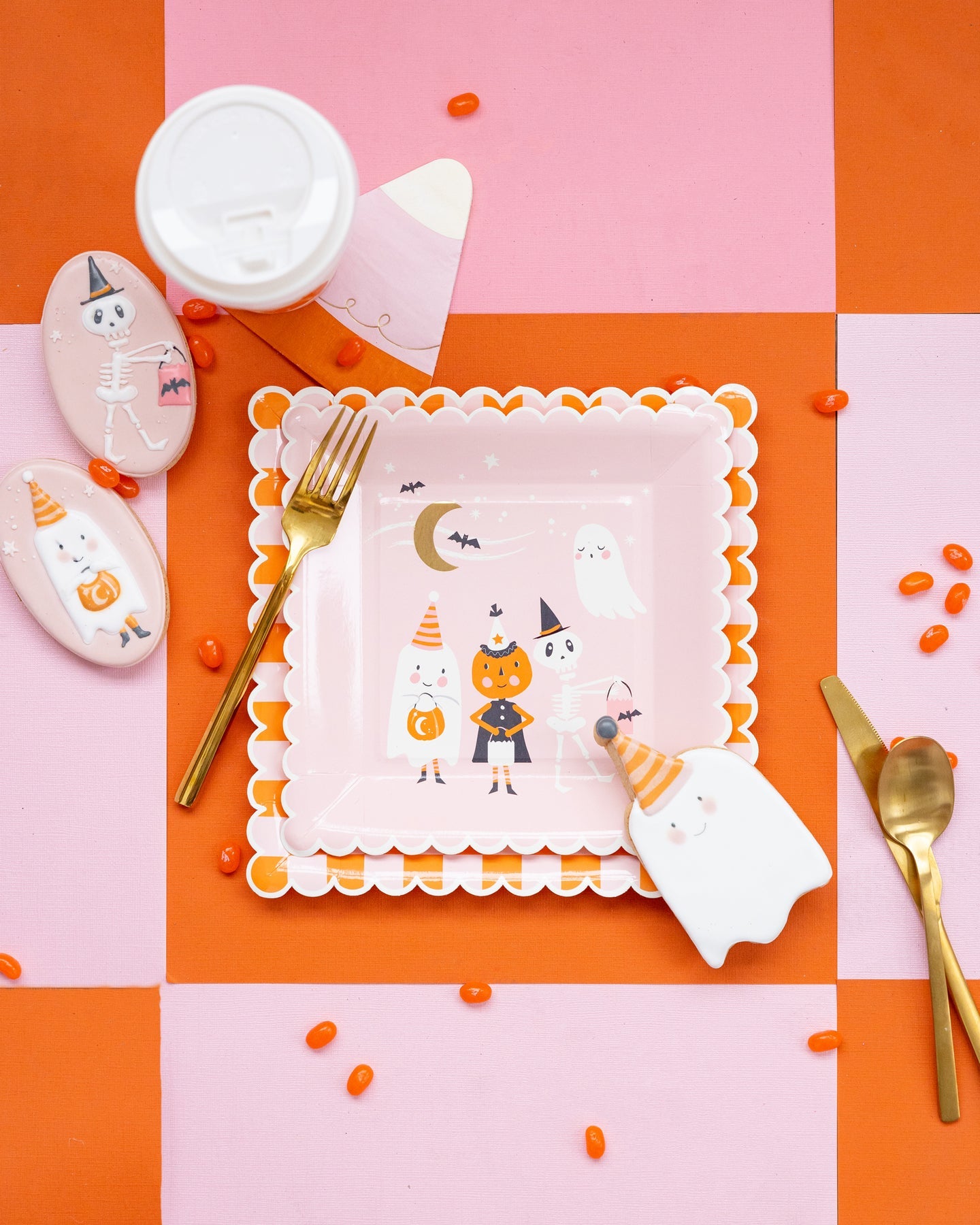 pink & orange checkered paper plate table setting