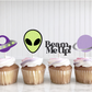Four cupcakes with space-themed toppers on a white background