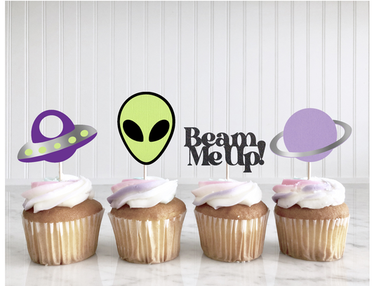 Four cupcakes with space-themed toppers on a white background