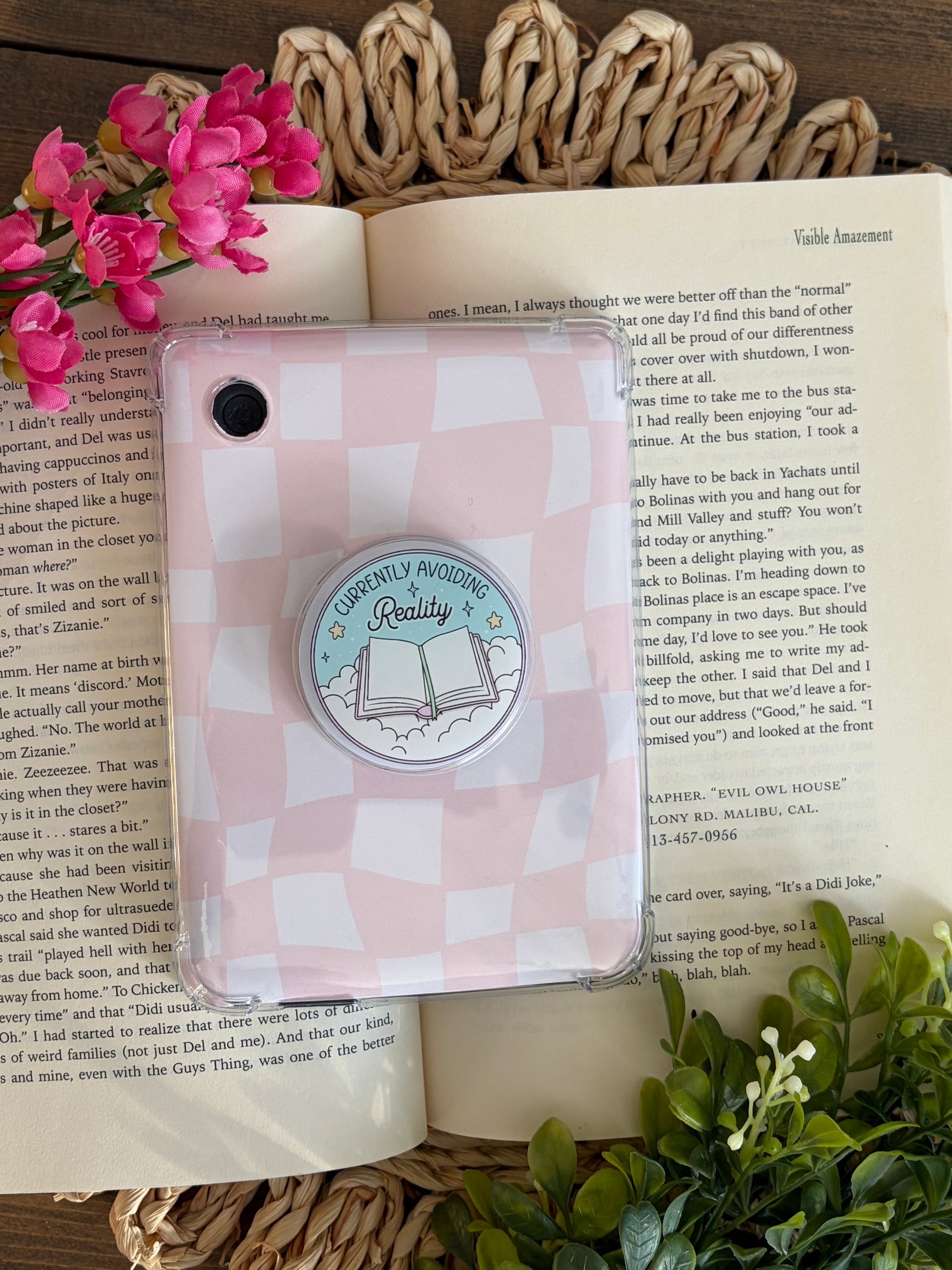 kobo e reader with pink case and currently avoiding reality grip