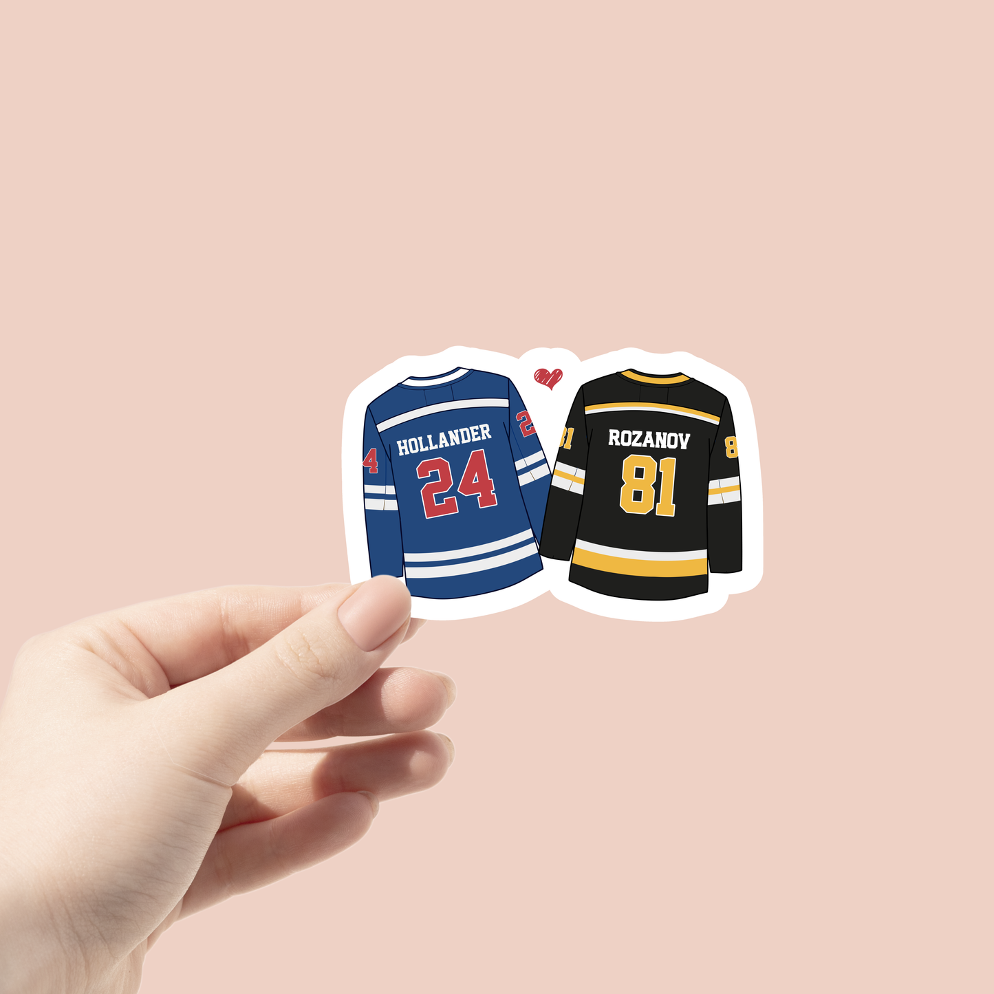 Two hockey jerseys, one blue with red text and one black with yellow text, held by a hand against a beige background.