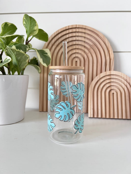 glass cup with a double sided uvdtf monsterra leaf pattern on it