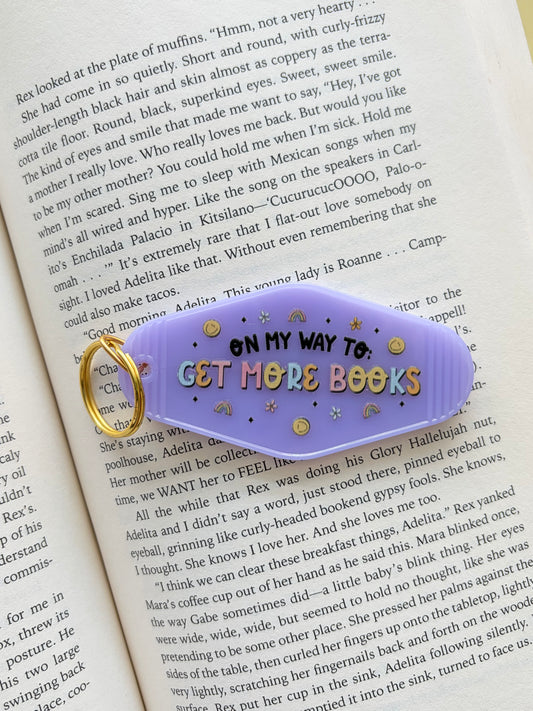 On my Way to Get More Books Motel Keychain