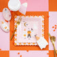 pink & orange checkered paper plate table setting 
