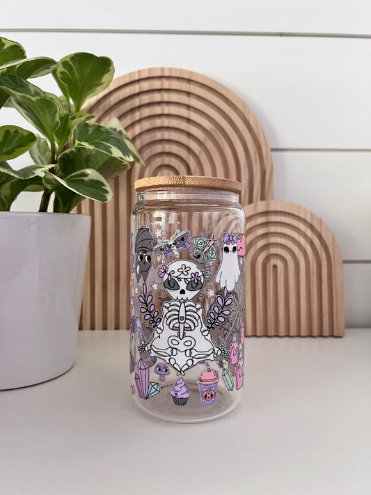 Glass Cup featuring an assortment of pastel colored halloween shapes