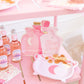 pink cauldron paper plates on a table