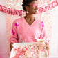 pink and gold cowgirl paper plates on a serving tray someone is holding