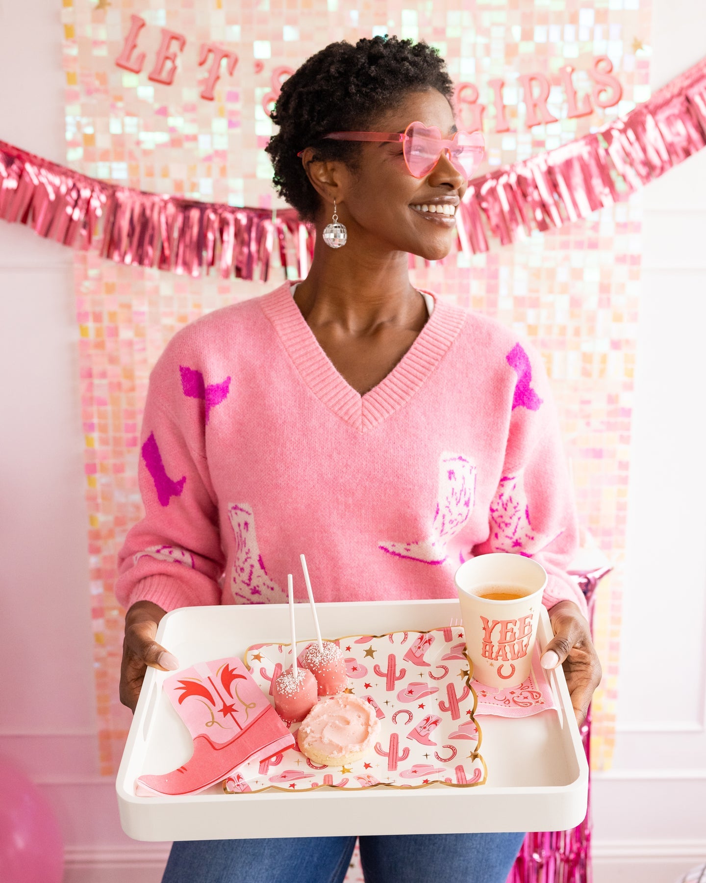 pink and gold cowgirl paper plates on a serving tray someone is holding