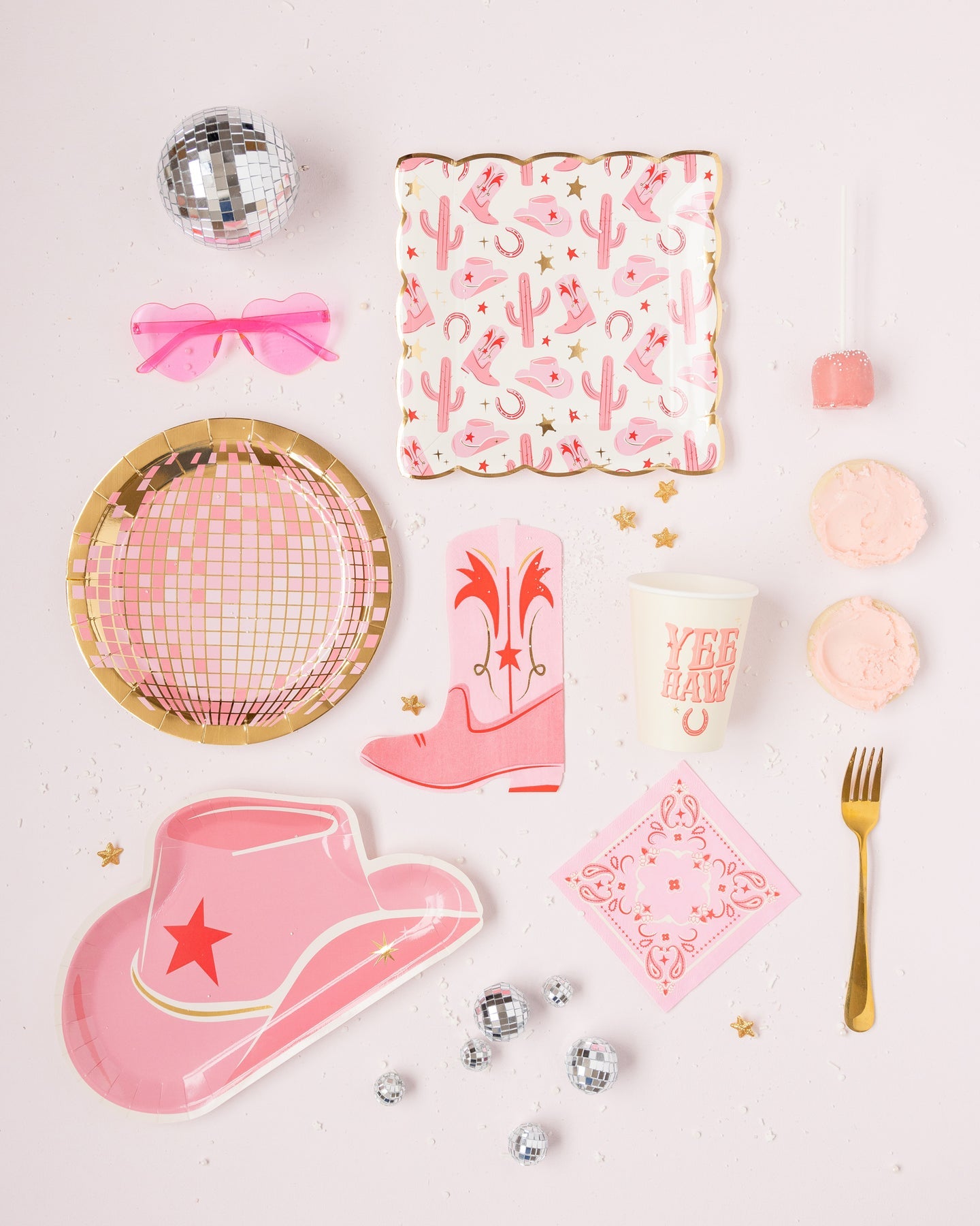 disco cowgirl flatlay with all the pink disco cowgirl items we carry