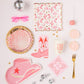 pink and gold cowgirl paper plates along with other cowgirl party items